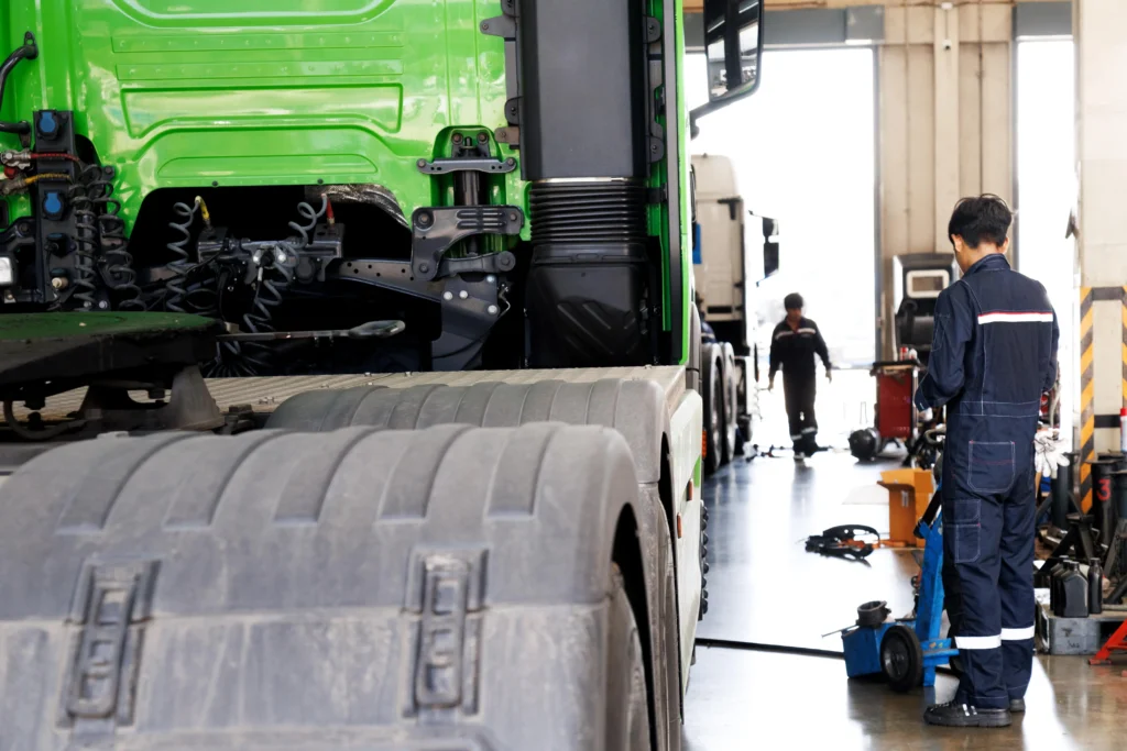 Current image: Fleet truck maintenance in service bay at Rusted Nuts Mechanical Services