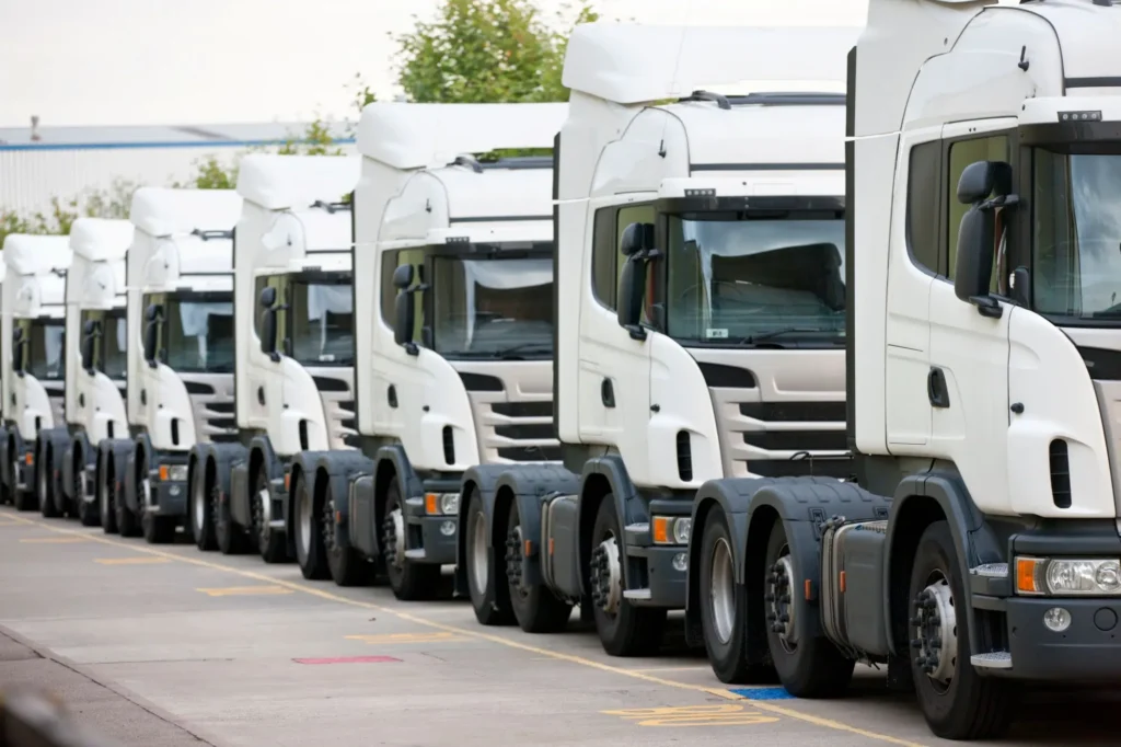Current image: mechanic prioritizing repair order across multiple commercial fleet trucks