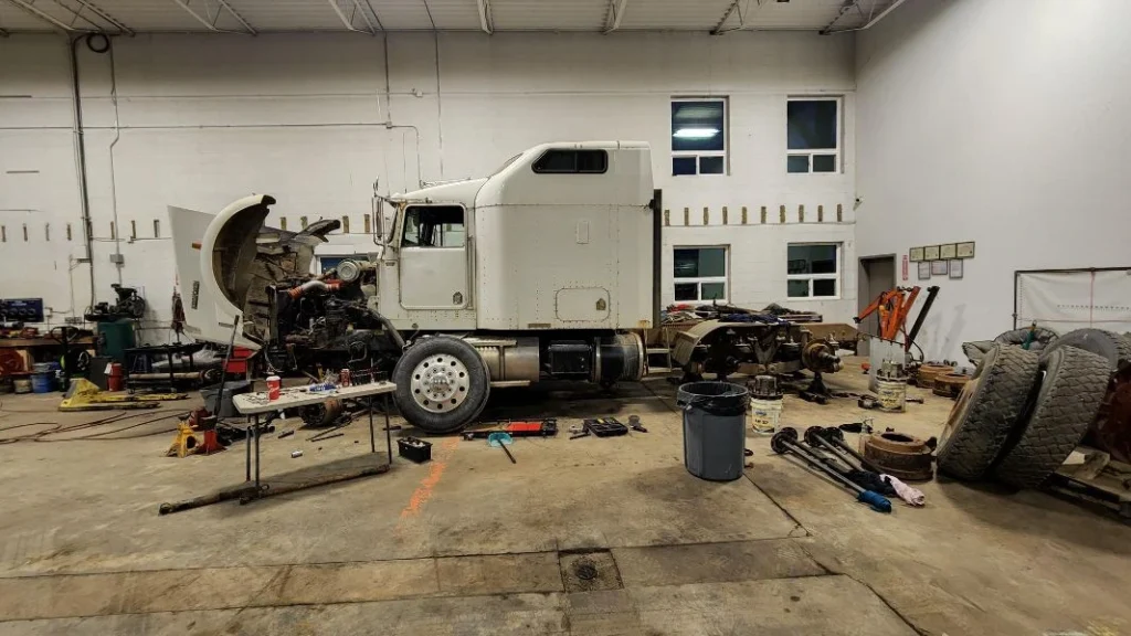 Truck in garage prepped for suspension repair