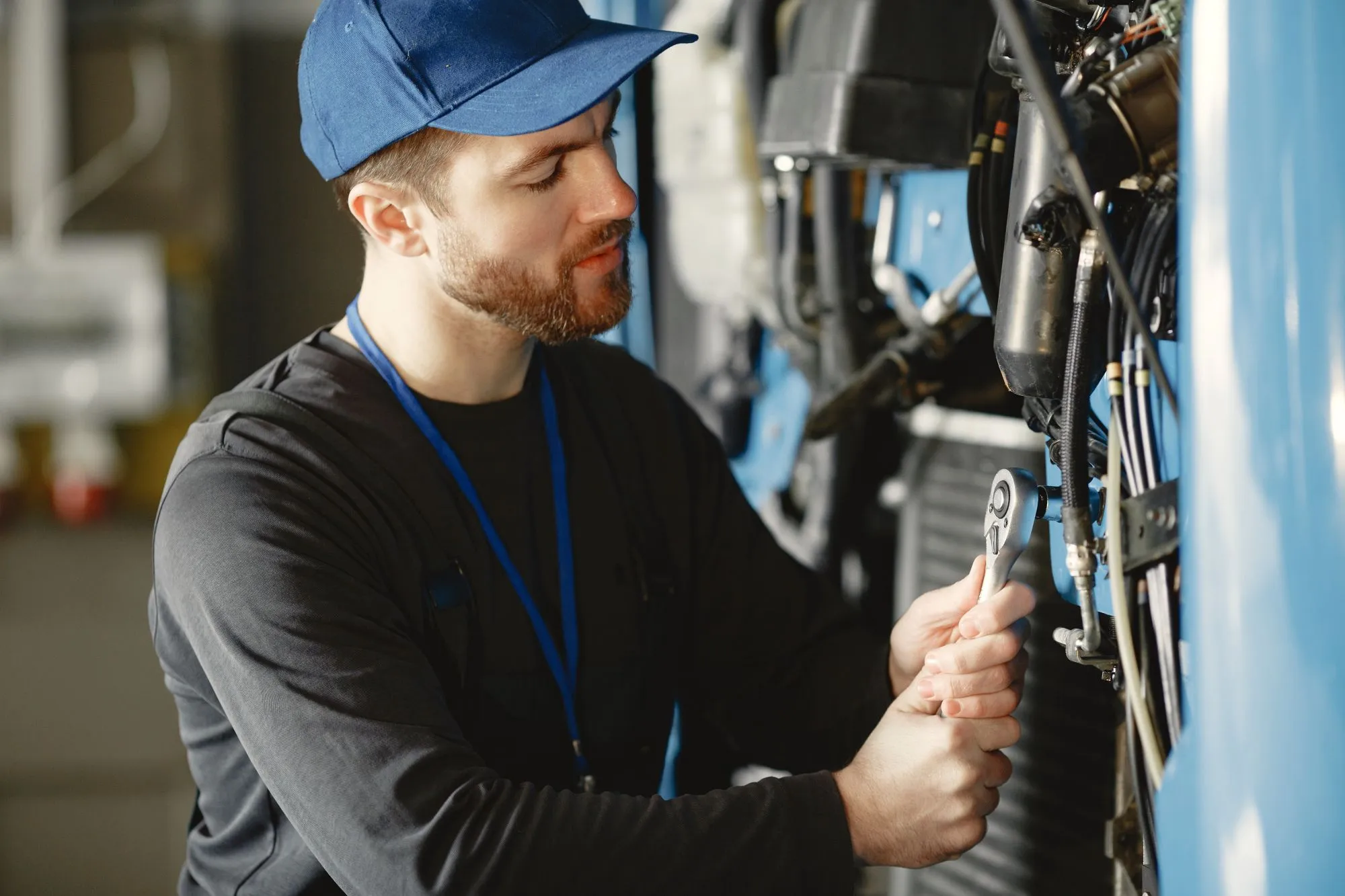 Mobile mechanic assessing a heavy-duty truck at a Calgary job site